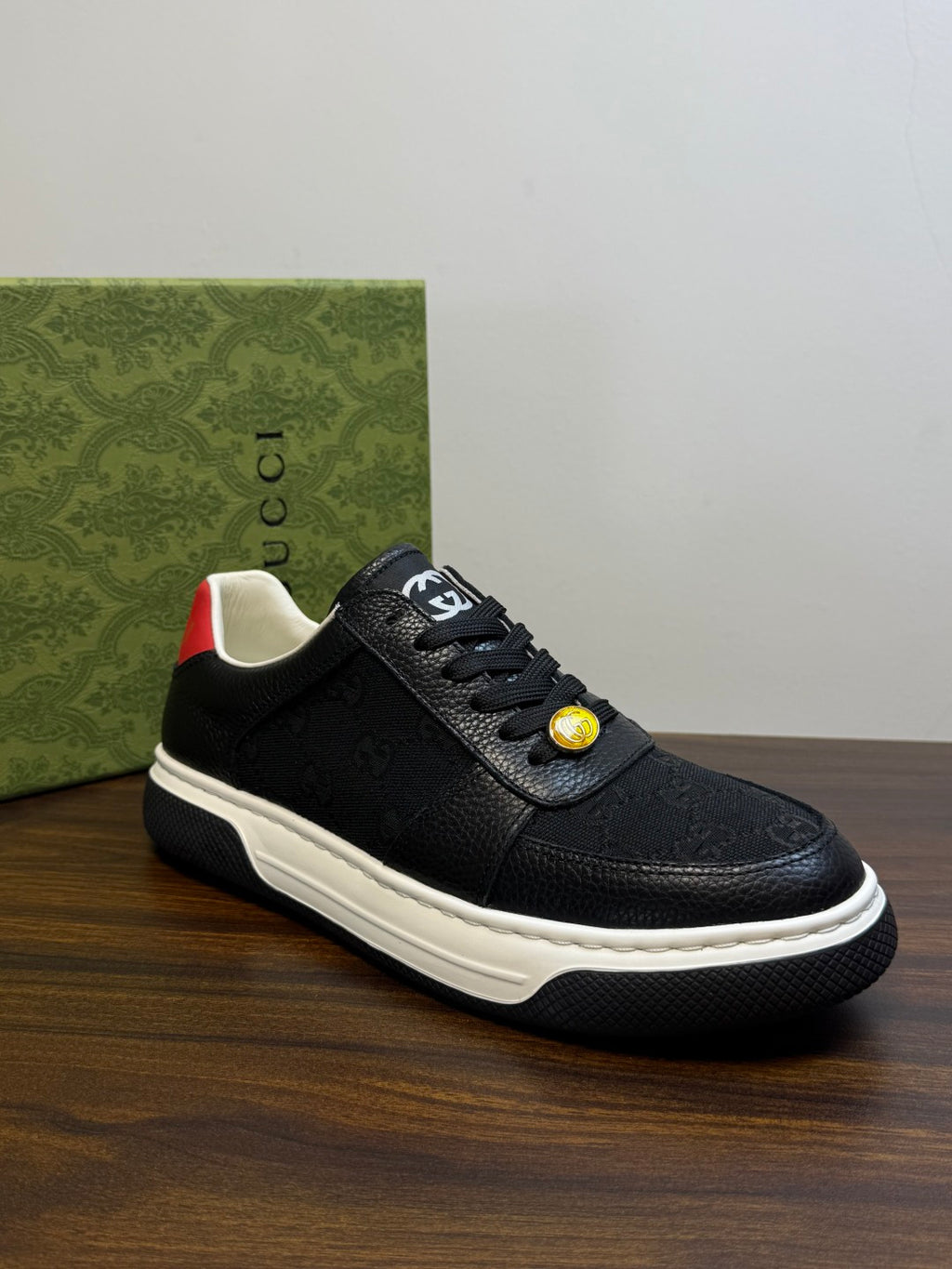 Gucci Ace Black GG Supreme Sneakers | Understated Style, Gold-Tone Accents & a Pop of Red