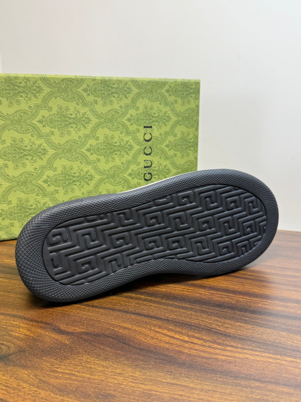 Gucci Ace Black GG Supreme Sneakers | Understated Style, Gold-Tone Accents & a Pop of Red