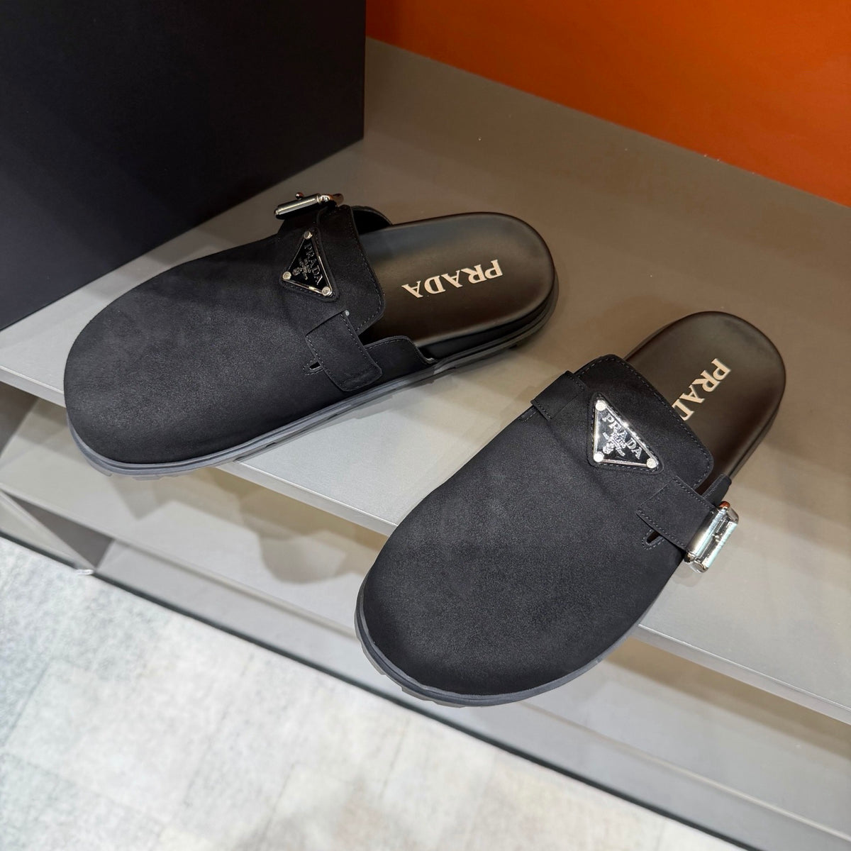 PRADA  Minimalist Black Mule Clogs | Metal Accents & Easy Slip-On Style