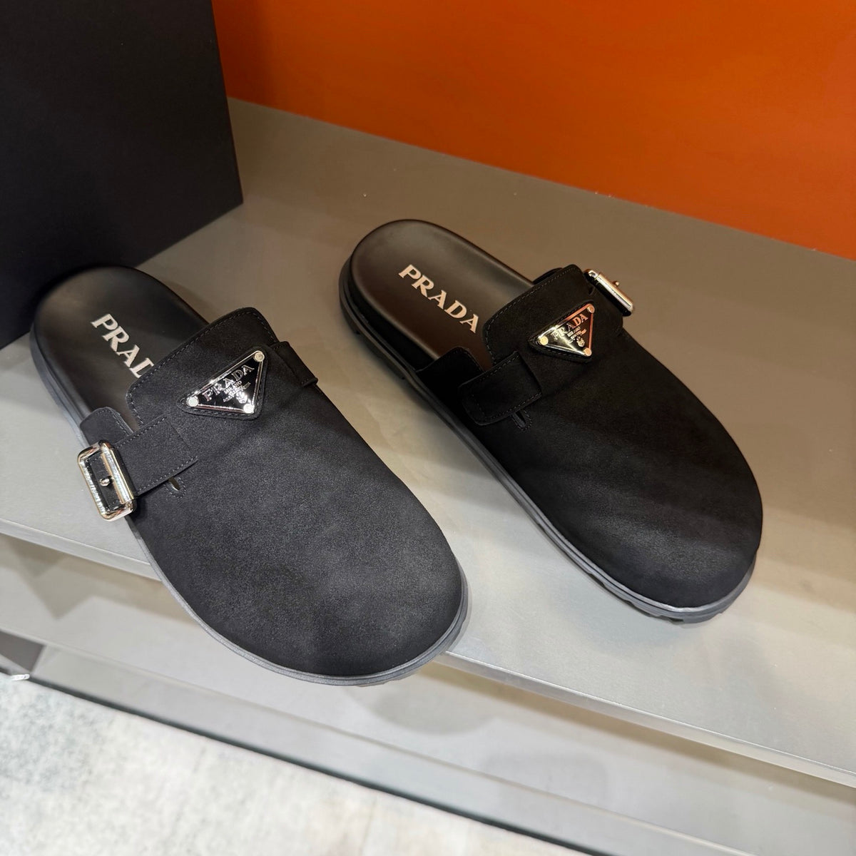 PRADA  Minimalist Black Mule Clogs | Metal Accents & Easy Slip-On Style