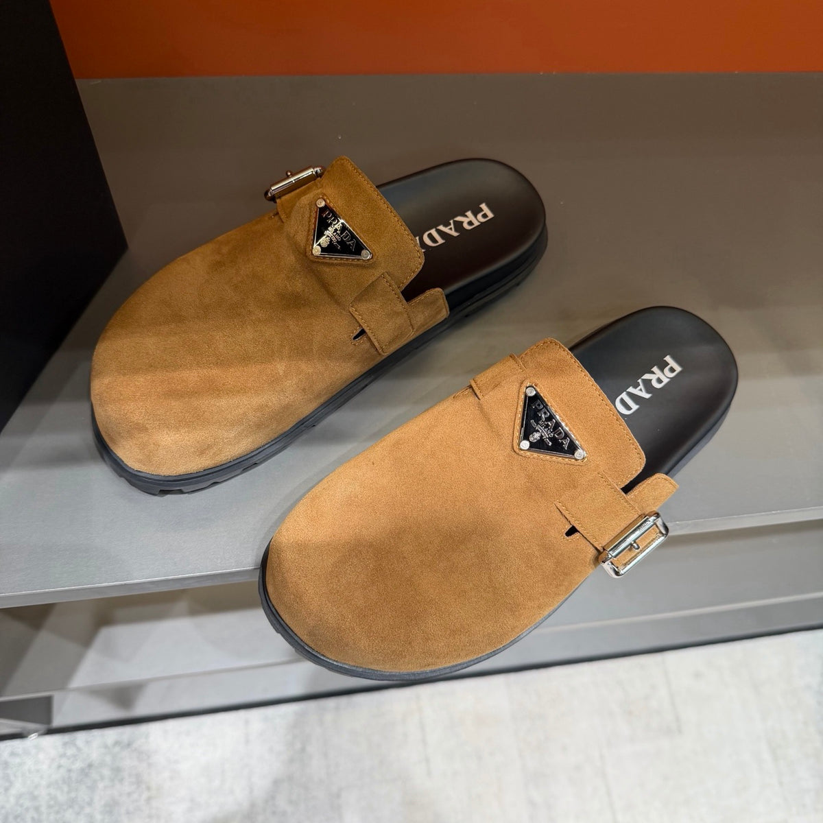 PRADA Men’s Camel Slip-On Mules | Triangle Logo & Metal Buckle Detail
