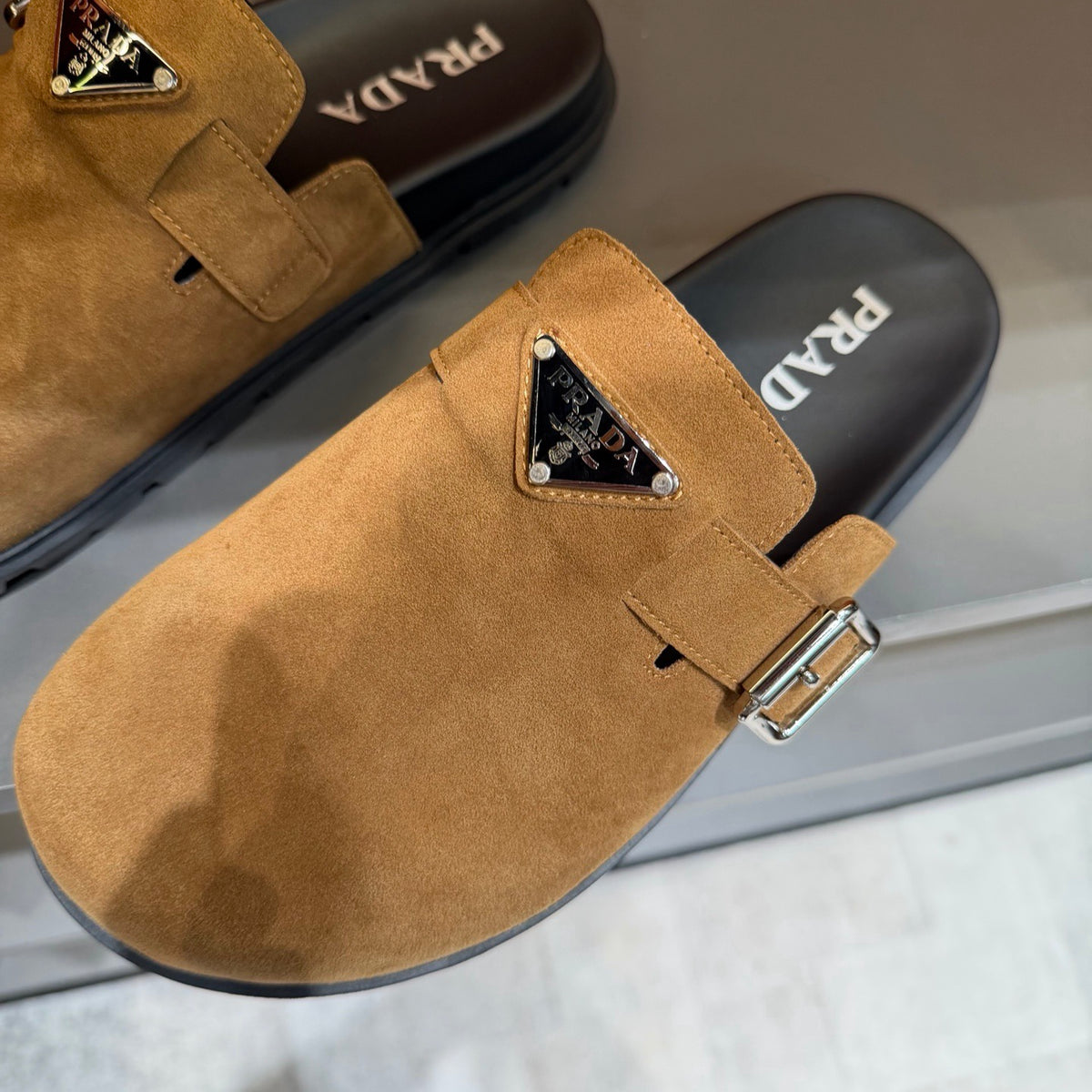 PRADA Men’s Camel Slip-On Mules | Triangle Logo & Metal Buckle Detail