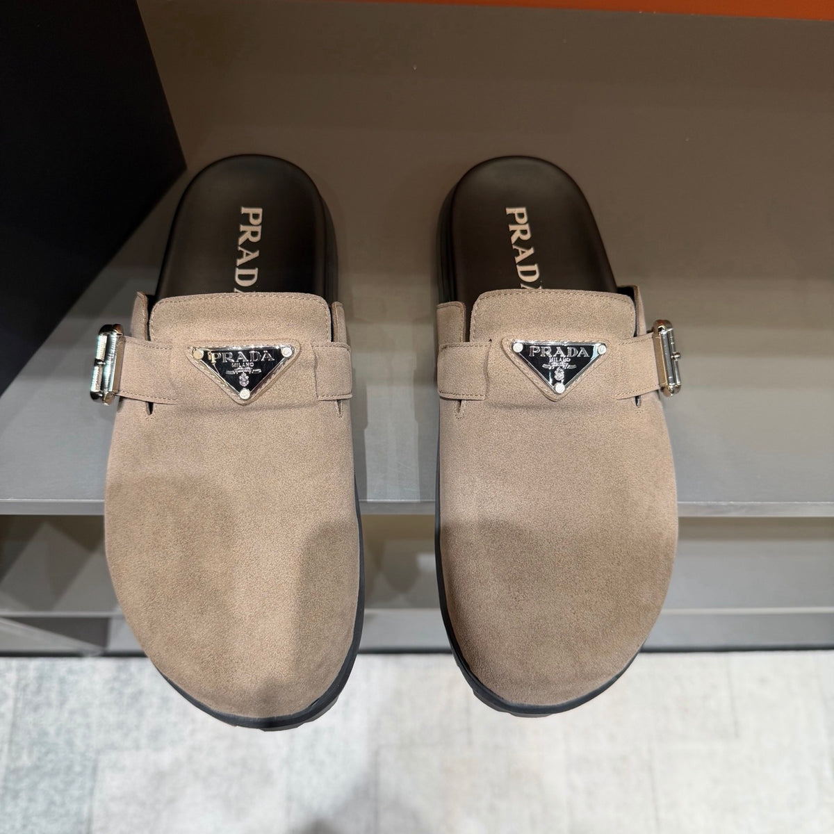 PRADA Men’s Sand Beige Mules | Triangle Logo & Metal Buckle Detail