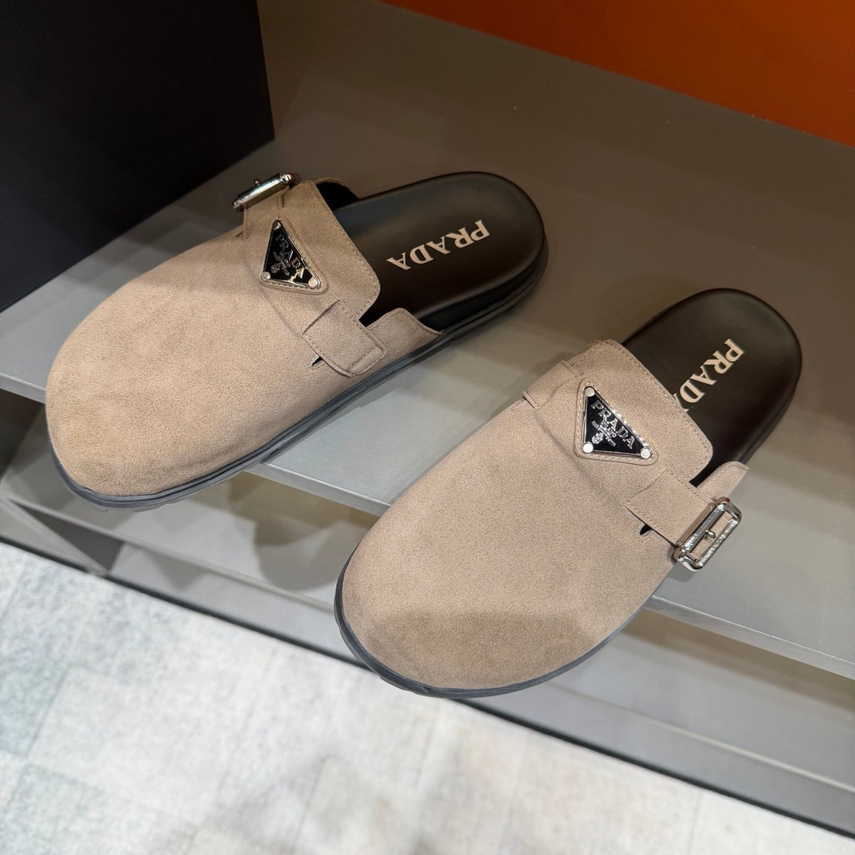 PRADA Men’s Sand Beige Mules | Triangle Logo & Metal Buckle Detail
