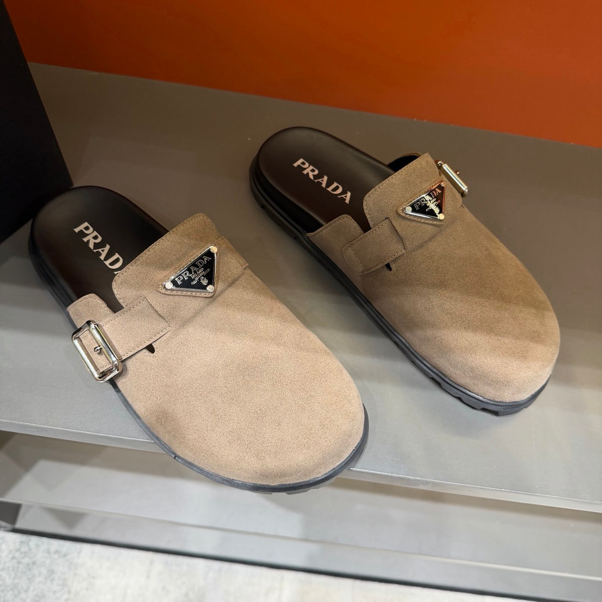 PRADA Men’s Sand Beige Mules | Triangle Logo & Metal Buckle Detail