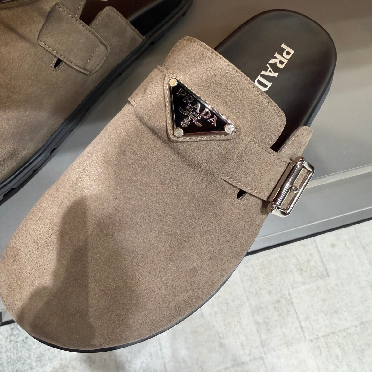 PRADA Men’s Sand Beige Mules | Triangle Logo & Metal Buckle Detail