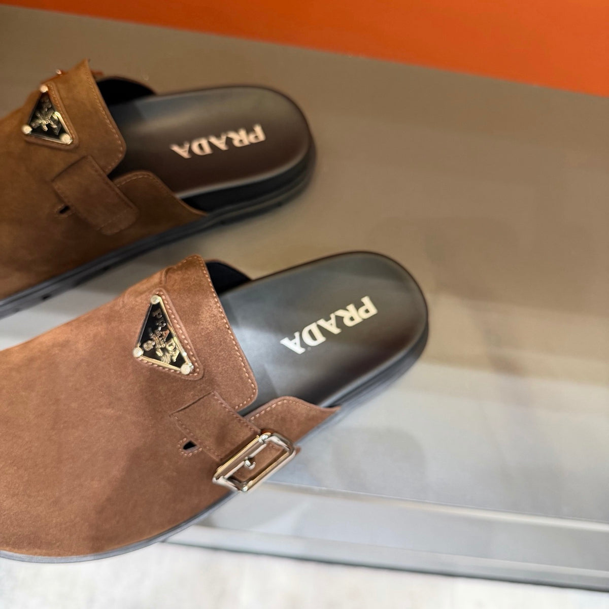 PRADA Men’s Warm Brown Mules | Triangle Logo & Metal Buckle Detail